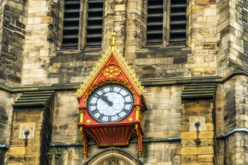 The ornate clock on the exterior of St. Nicholas Cathedral, or Newcastle Cathedral in the historic city of Newcastle.