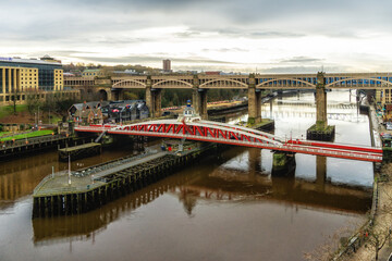 Fototapeta na wymiar Newcastle-upon-Tyne, England, UK. Swing Bridge in Middle Ground, High Level Bridge in Background, linking Gateshead to Newcastle.