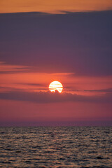 Vertical shot of an amazing sunset over the sea