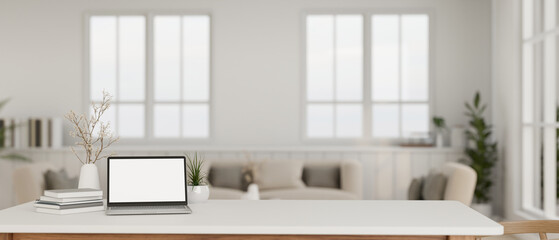 Minimal white home workspace with laptop mockup and copy space on a tabletop