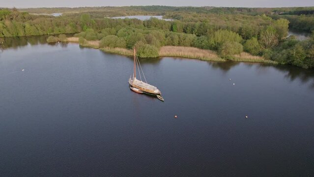 Anti clockwise orbit shot around Solace, a traditional Norfolk wherry moored up on Wroxham Broad in the heart of the Norfolk Broads National Park. Captured on a bright and sunny summer evening