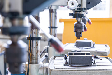 Drill press for workshop and craft metalwork in factory or industrial plant.