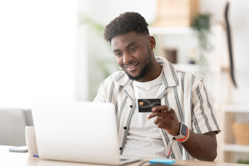 Young black man shopping online