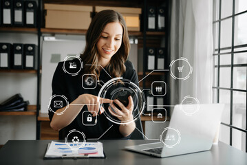 businesswoman hand working with mobile phone and modern compute with VR icon diagram at office