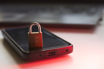 Closeup of closed metal padlock on modern smartphone, personal data protection Security concept