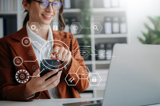 API Application Programming Interface, woman using laptop, tablet and smartphone with virtual screen API icon Software development tool, modern technology concept.