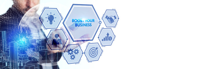 Business, Technology, Internet and network concept. Young businessman shows the word: Boost your...
