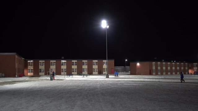 prison exterior wide shot winter evening night jail correctional facility 4k