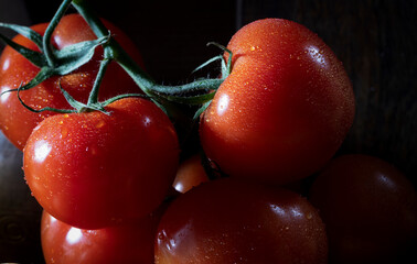 Red tomatoes on a black background