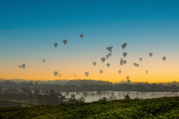 The scenery of hot air balloons floating in the sky in the morning