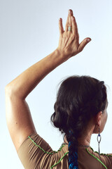 Naklejka premium Back view portrait of middle aged yogi woman with brown hair practicing yoga at studio
