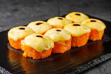 warm sushi roll with tuna and cheese cap