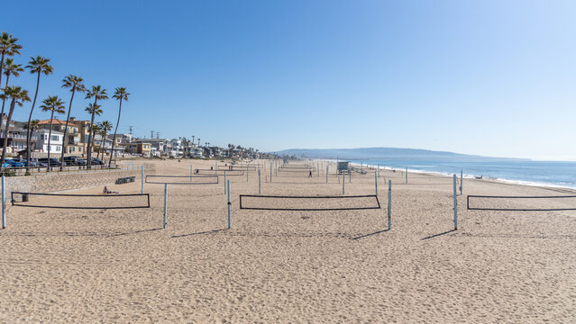 The Manhattan Beach volley ball courts and nets adjacent the pier in California USA on February 9th 2023