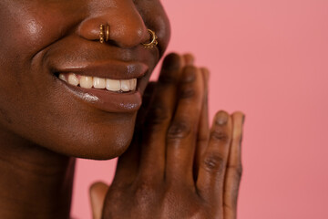 Close-up of smiling woman with nose piercings © Cultura Creative