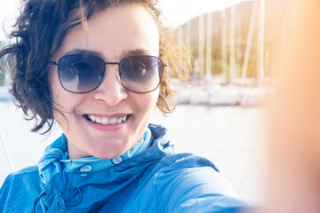 Woman sailing, taking selfie