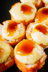 warm sushi roll with tuna and cheese cap