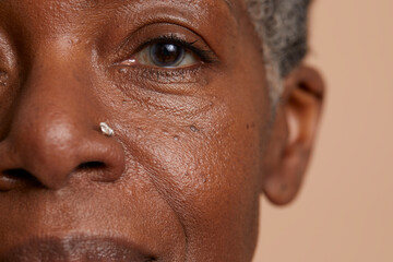 Close-up portrait of senior woman looking at camera