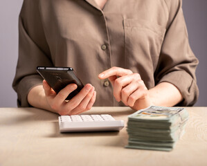 Calculating costs, expenses, savings with calculator and smartphone