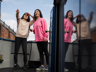 Two women on boat looking at view