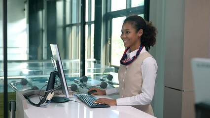 Female receptionist smiles for customers who come to use the service, service of transport companies.