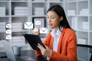 Businessman looking for laptop and thinking businessman reading emails on laptop in office.