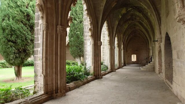 Walking through arches of beautiful Bellapais Monastery, religion and historic architecture in Northern Cyprus