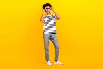Full body photo of young handsome man student fits his new glasses look interested empty space...