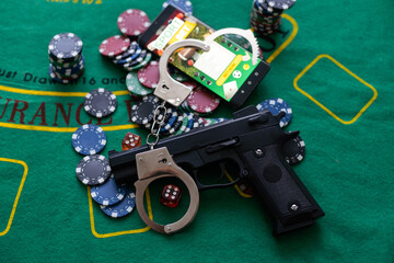 Illegal gambling concept handgun with betting chips.