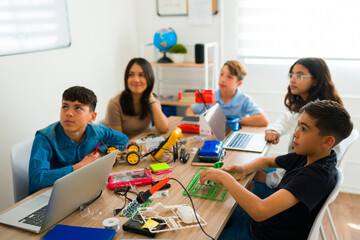 Smiling cheerful students enjoying their coding course