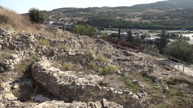 Contrast between remains of Choirokoitia (an ancient archaeological site) and a modern highway in the background, history and culture Cyprus
