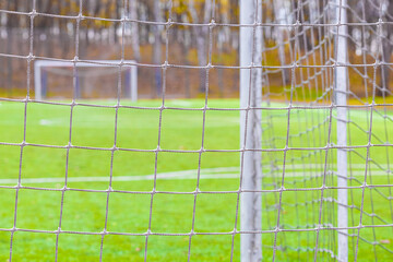 Safety net on an empty football field.