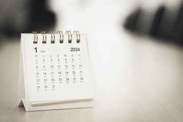Calendar page January of the year 2024 white color in meeting room in office. with copy space and...