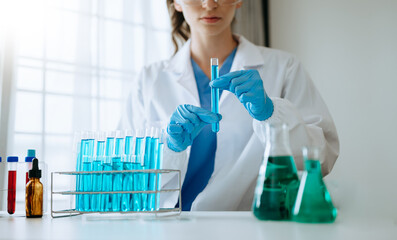 Modern medical research laboratory. female scientist working with micro pipettes analyzing biochemical samples, advanced science chemical laboratory