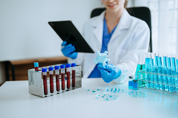 Modern medical research laboratory. female scientist working with micro pipettes analyzing biochemical samples, advanced science chemical laboratory