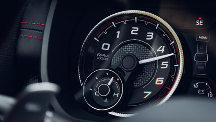 Naklejka premium close up black car panel, digital bright tachometer. Tachometer arrow shows speed