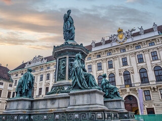Fototapeta premium The inner courtyard at the Hofburg palace and the Emperor Franz Statue, Vienna, Austria
