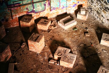 Brickwork bases for several industrial devices in an abandoned factory