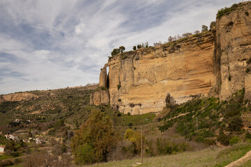 Bizarre mountains, rocky gorges against the sky. Landmark of the city of Ronda, Andalusia, Spain