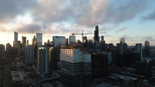 Drone Shot Around A Construction Project With The Chicago Skyline In The Background