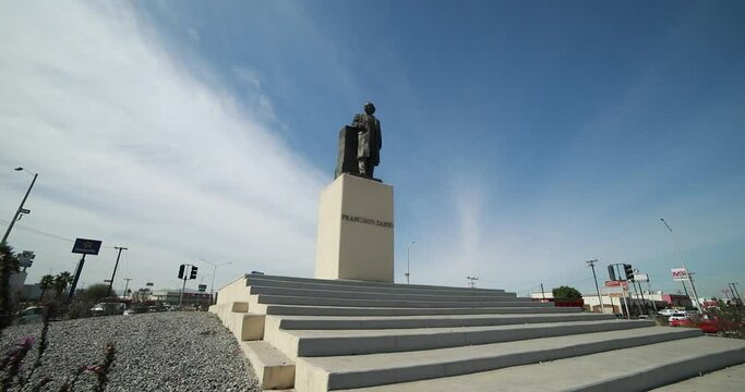 Low view of a monument statue of the mexican ex-president Francisco Zarco in a roundabount in the city of Mexicali