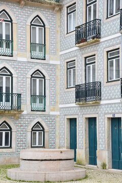 facade of an old house with traditional hand crafted glazed ceramic tiles, Lisbon, Portugal