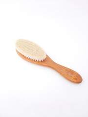 Hair brush isolated on white background. Baby hair brush that is soft and safe to use on baby's head