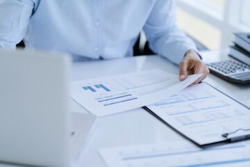 Small business accounting Businesswoman Accountant verify growing business with calculator. Accountancy