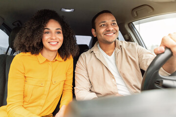Joyful Black Couple Enjoying Travel By Car Sitting In Auto