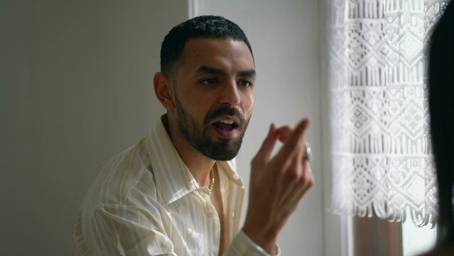 man discussing relationship with girlfriend off camera. Dramatic serious guy in verbal altercation