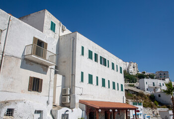 A white building for accommodation on a sea with a balcony