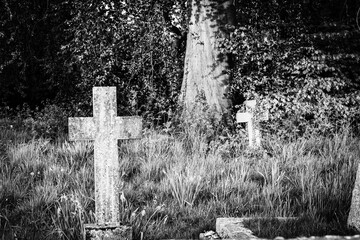 old stone crosses in black and white