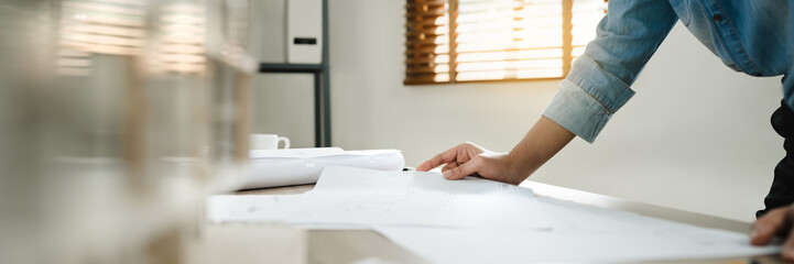 Man architect working  On the desk.construction project ideas architects engineer Concept