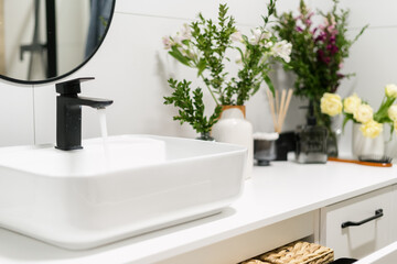 Fototapeta na wymiar wash basin with water faucet at luxury hotel washroom