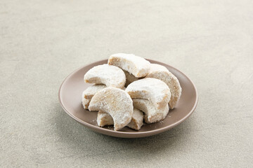 Kue Putri Salju or Snow White Cookies with crescent shaped. Made from flour, sugar and butter coated with powdered sugar. 
